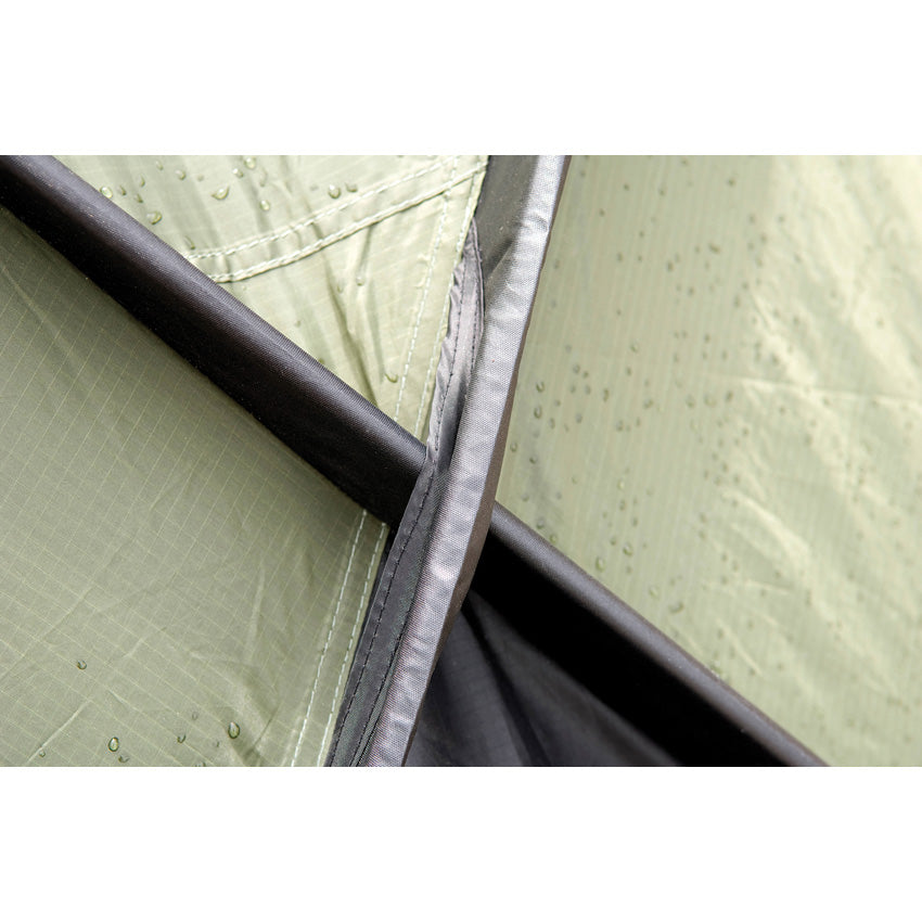 Snugpak Scorpion Tent by Americana Pipedream Apparel, shown set up outdoors with rainfly and mesh windows in a natural camping setting.