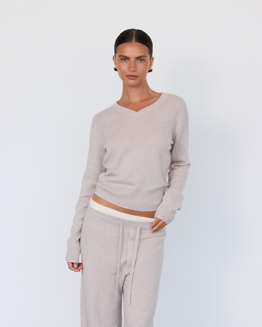 Artless Forever Tove V-Neck Sweater in soft knit, shown in a close-up highlighting the V-neckline and cozy texture.