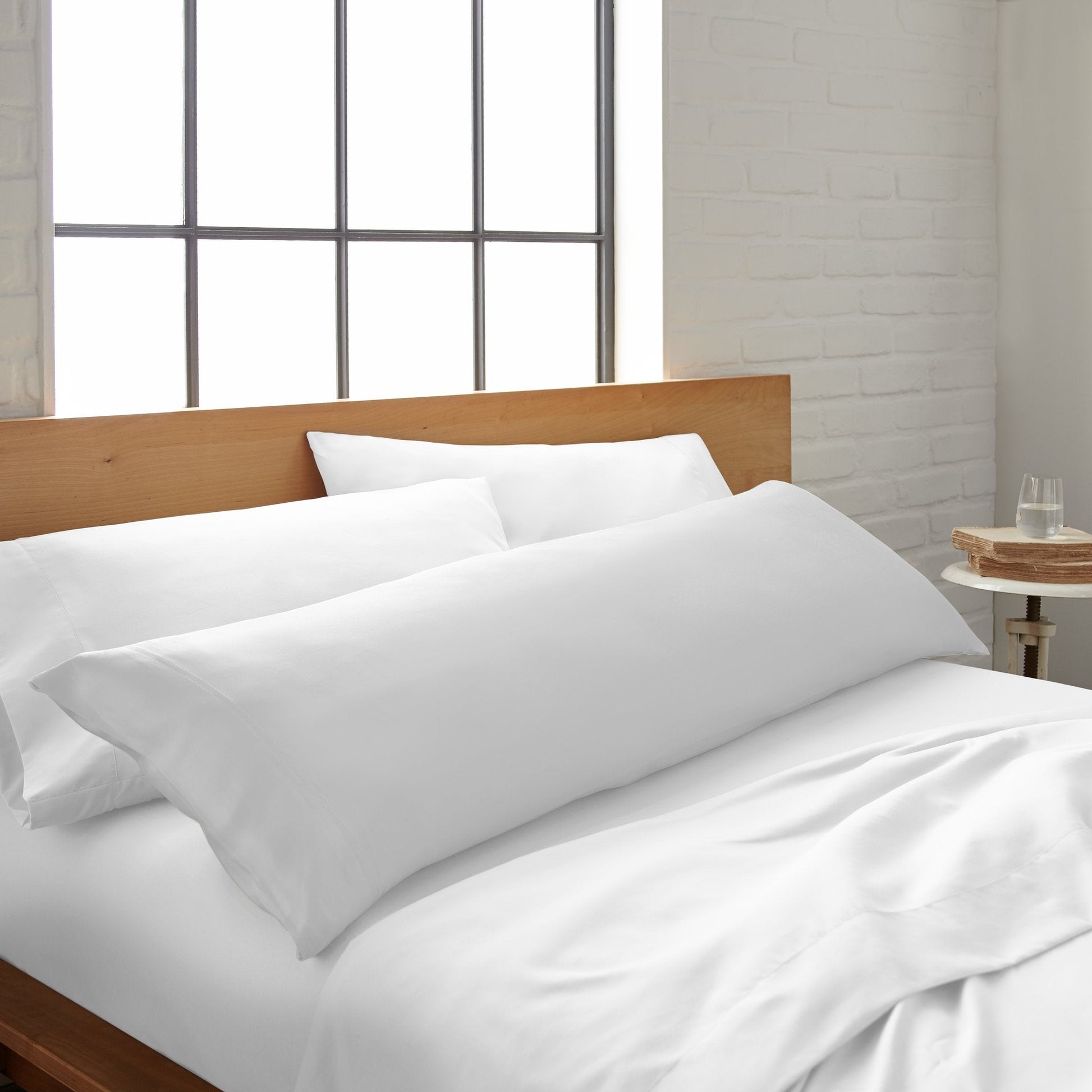 White bamboo body pillowcase from Bamboo is Better on a bed, showcasing smooth, cooling bamboo fabric for comfortable sleep.