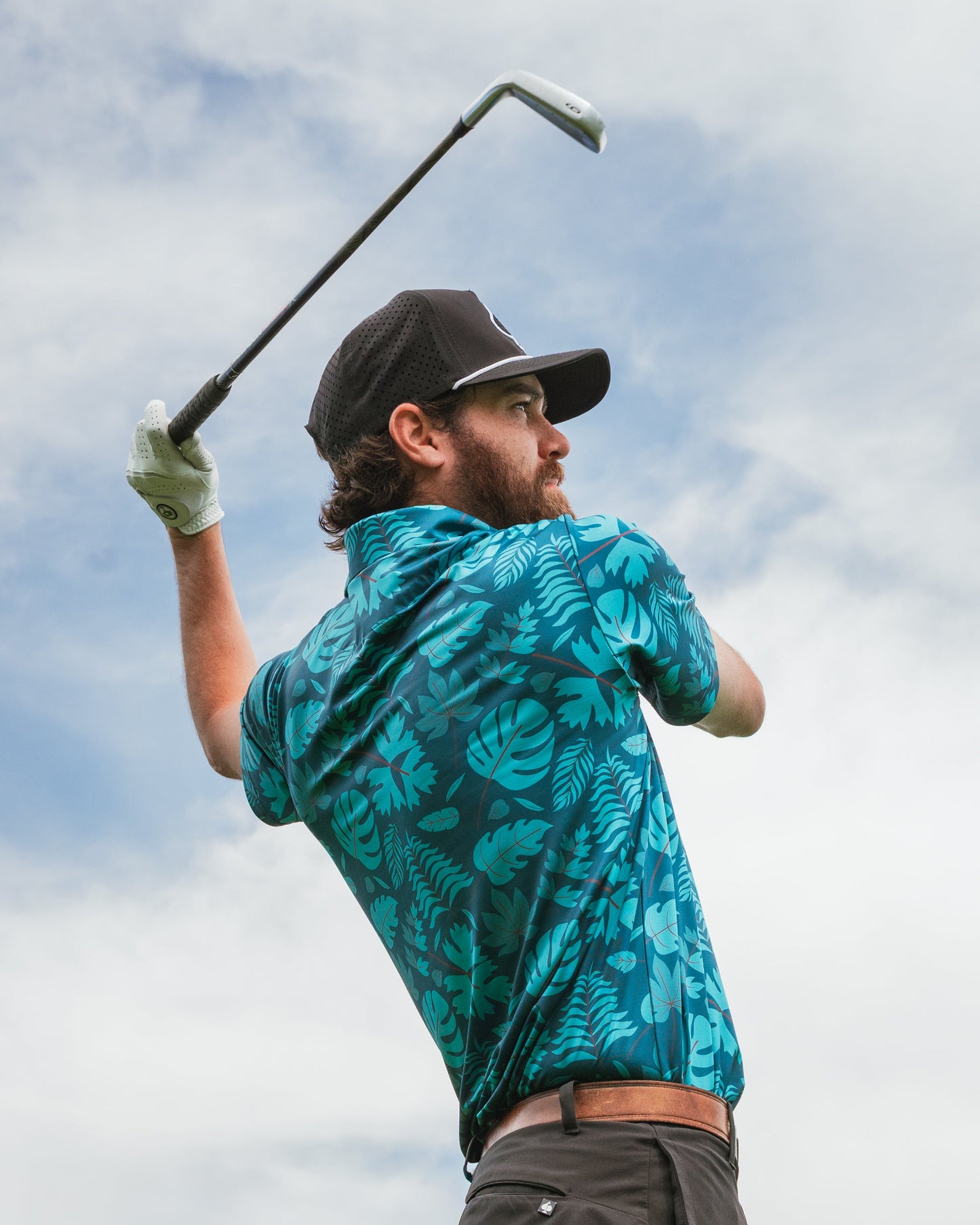Men's Cabana Nights polo shirt by Pins and Aces featuring a vibrant, tropical-inspired design and comfortable fit.