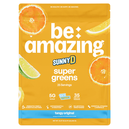 Bright image of Be Amazing Super Greens powder in a jar with a tangy orange flavor label, showcasing vibrant green powder inside.