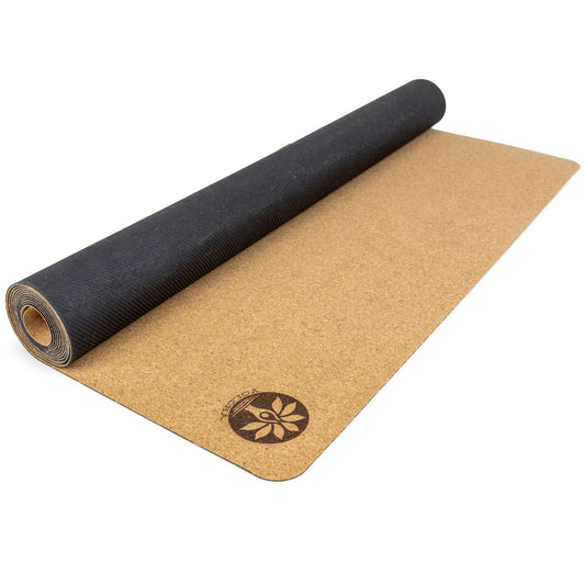 Yoloha Yoga Nomad Air Cork Yoga Mat laid out on a wooden floor, showing its textured cork surface and portable design for yoga and Pilates.