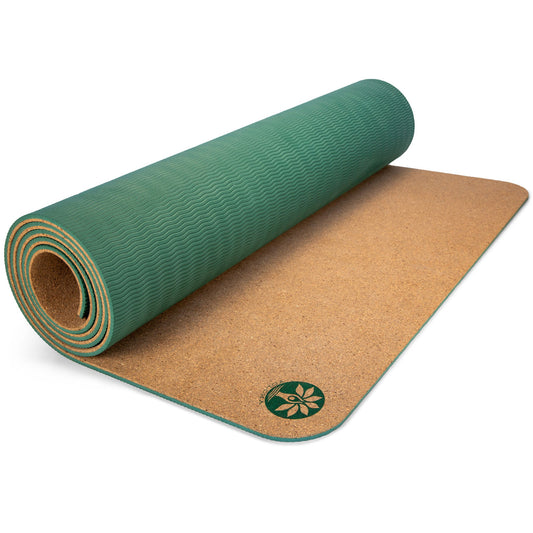 Yoloha Yoga Unity Pro cork yoga mat laid out on a wooden floor, showcasing its textured surface and eco-friendly design.