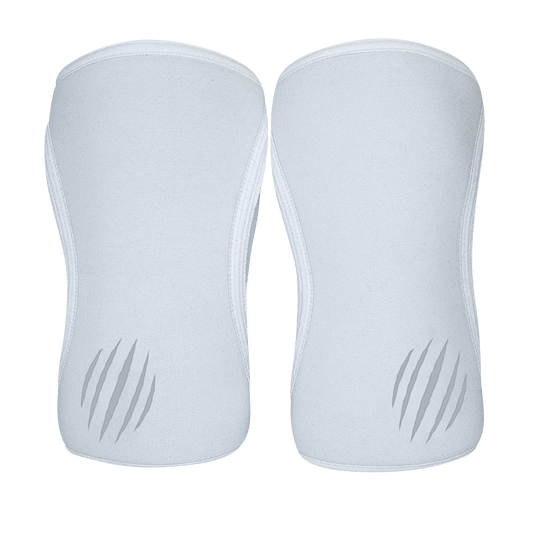 White Bear KompleX knee sleeves shown on a model, featuring snug fit and reinforced stitching for support during weightlifting.