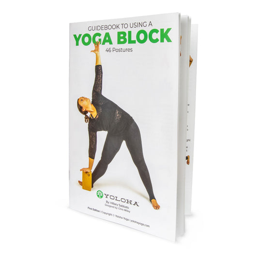 Yoloha Yoga guidebook featuring exercises and tips for using yoga blocks in practice, with illustrations and instructions.