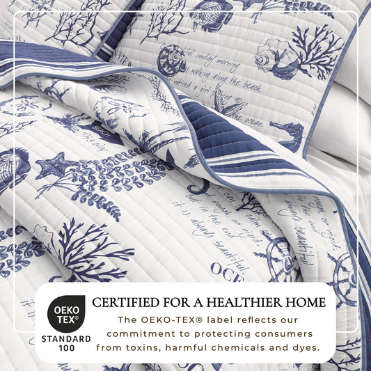 Coastal printed cotton quilt set from Great Bay Home's Calypso Collection displayed on a bed with coastal-themed decor.