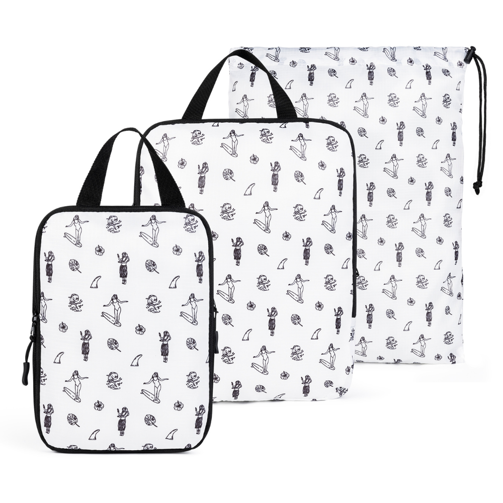 White compression packing cube set by COR Surf with three organized travel accessories for efficient packing.