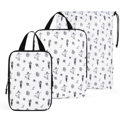 White compression packing cube set by COR Surf with three organized travel accessories for efficient packing.