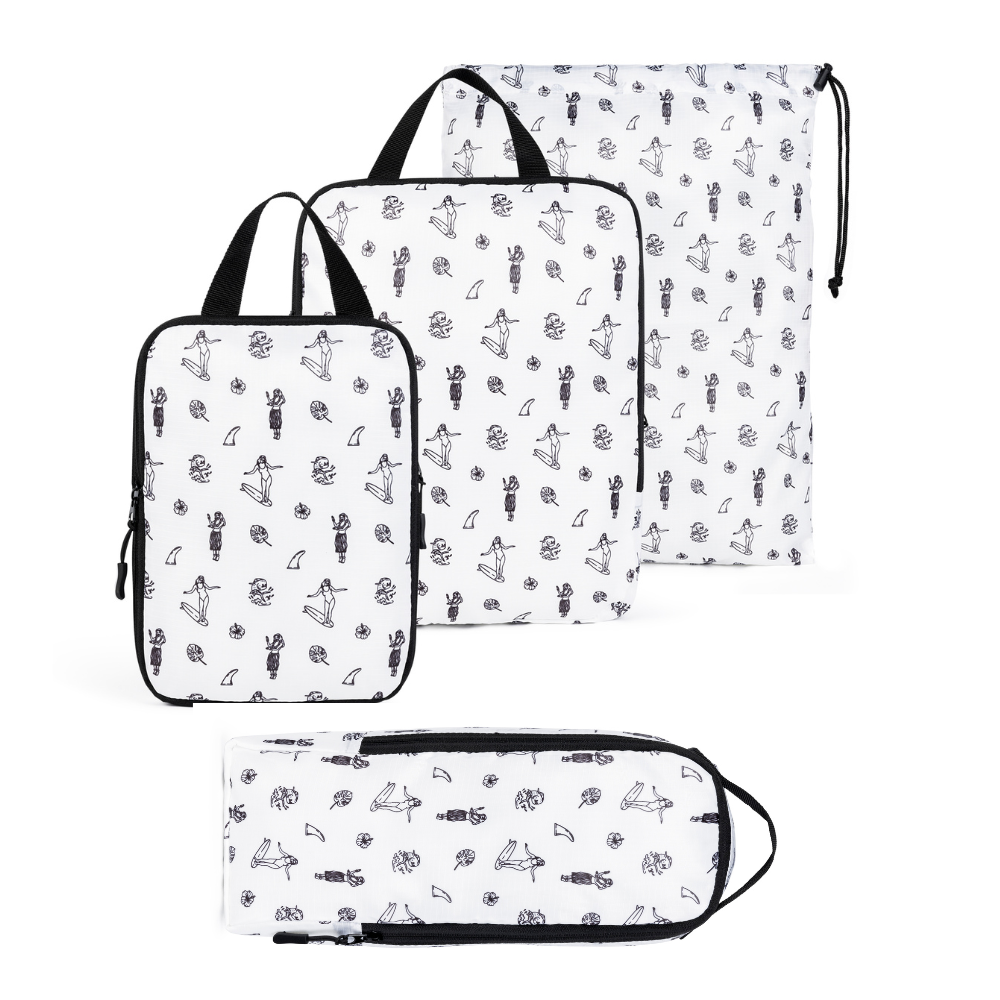 Set of four white compression packing cubes by COR Surf, designed for efficient travel organization and space-saving.