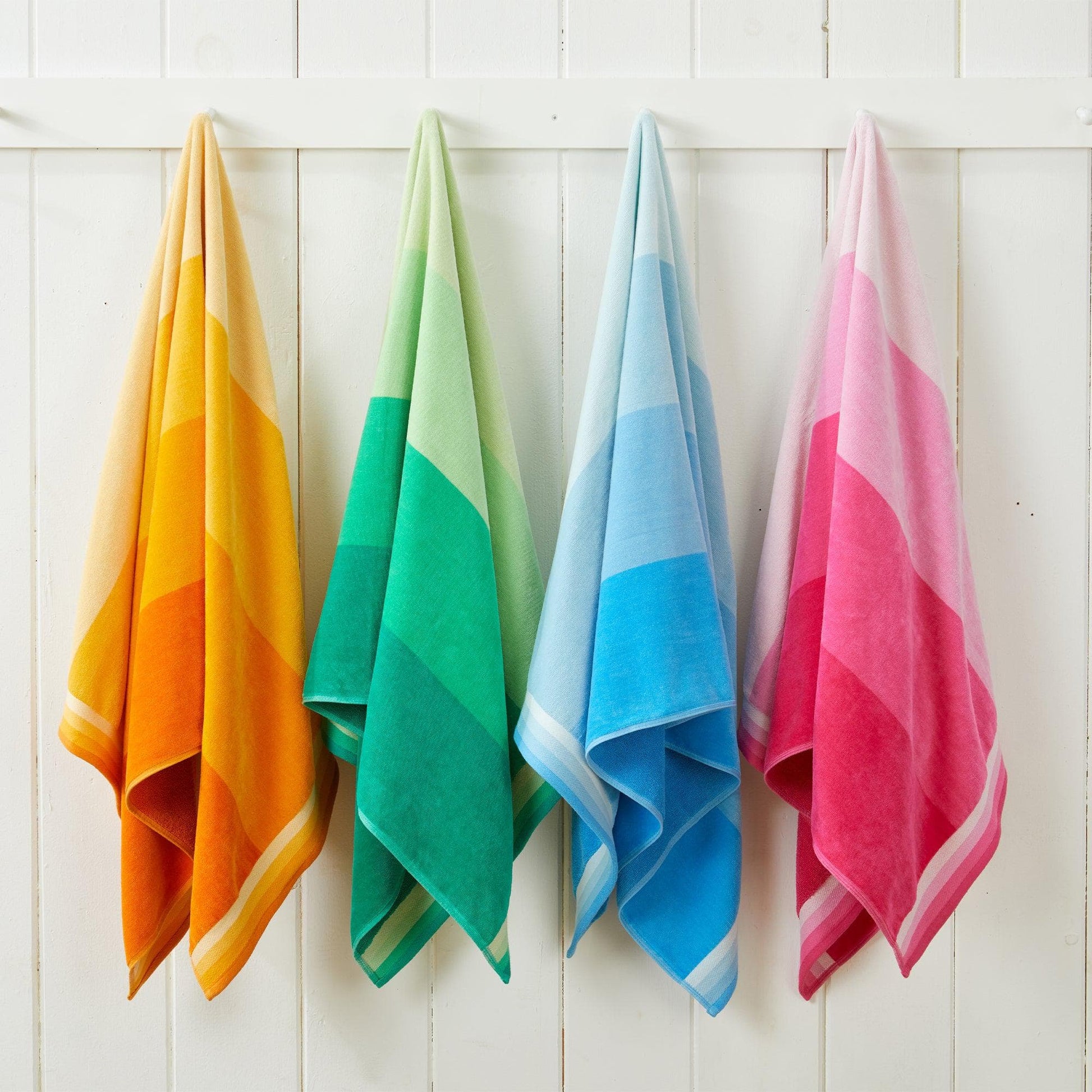 Cotton velour cabana stripe beach towel from Great Bay Home's Novia Collection, featuring vibrant striped pattern and soft texture.