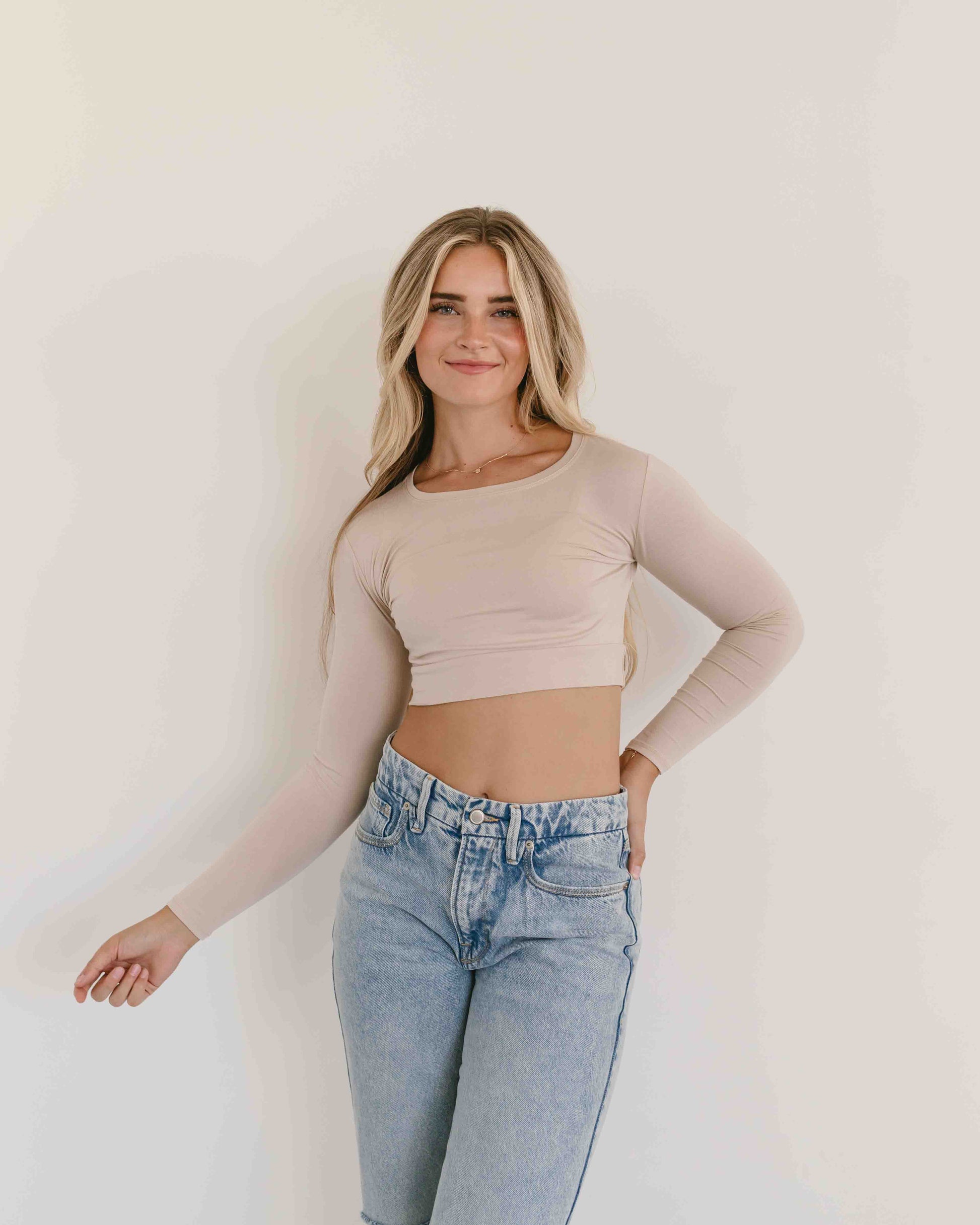 Cream-colored crew neck long sleeve halftee by HALFTEE Layering Fashions, showing its soft fabric and fitted design.