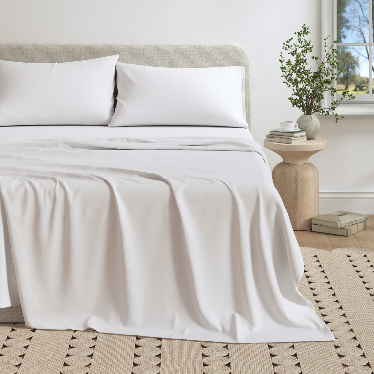 Soft beige jersey sheet from Great Bay Home Carmen Collection, showing smooth, stretchy fabric on a neatly made bed.
