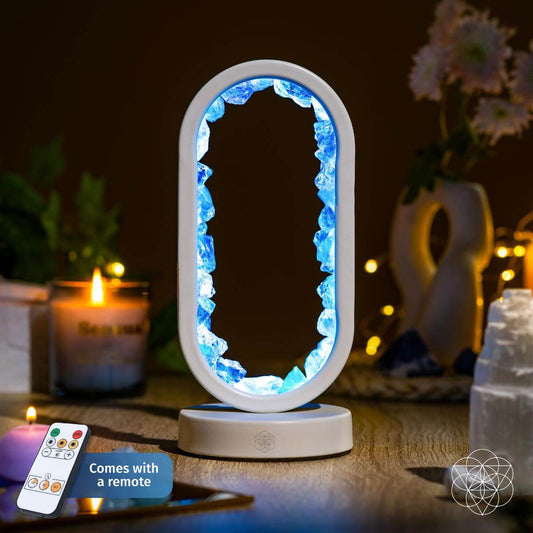 Clear quartz night light from Conscious Items, shaped as the Manifest Success lamp of achievement, with a glowing illumination.