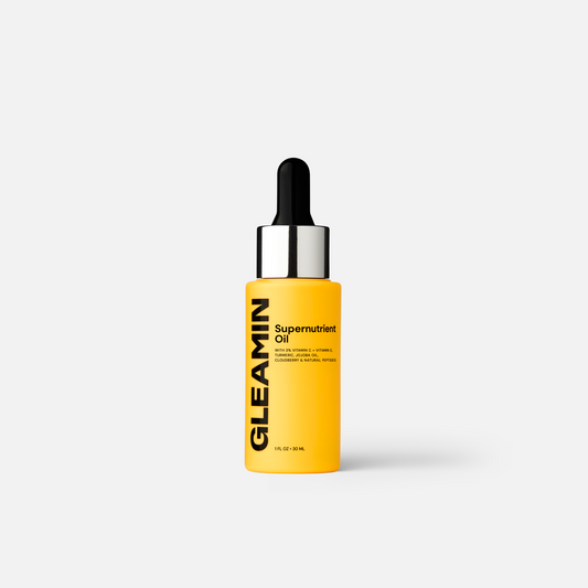Gleamin Supernutrient Face Oil bottle shown, highlighting nourishing skincare with natural ingredients in a sleek design.