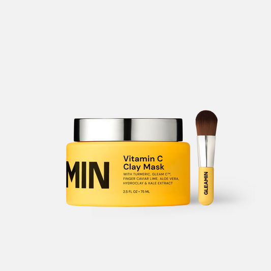 Gleamin Vitamin C Clay Mask in a jar, showcasing the face mask with a smooth, creamy texture and bright orange color.