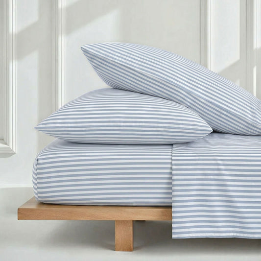 Italic Luxe Australian Sateen Sheet Set on a bed with neatly made white sheets and pillows, showcasing smooth, luxurious fabric.