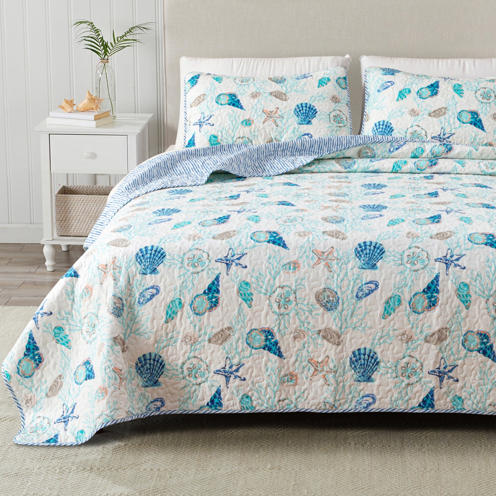 Coastal quilt set from Great Bay Home Bali Collection featuring tropical patterns and soft fabric for a relaxed bedroom look.