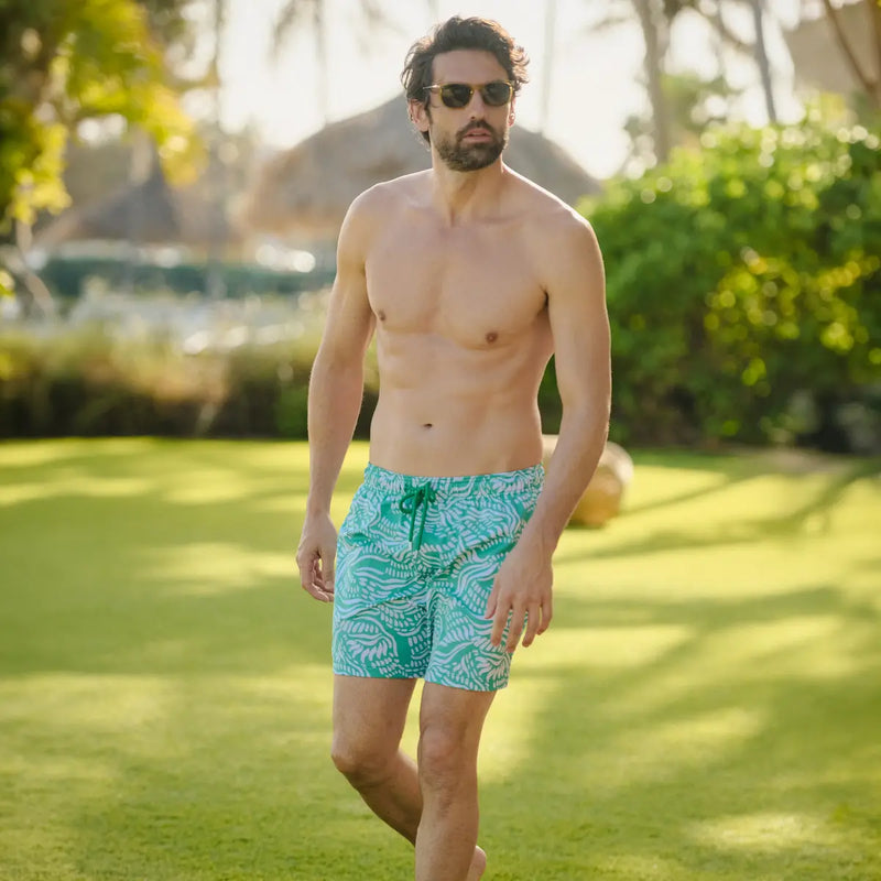 Men’s Capelle Miami hybrid compression-lined shorts with salt spray palm and surf print, showcasing a stylish coastal lifestyle.