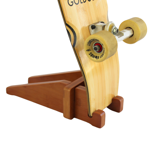 Cor Surf bamboo skateboard floor stand holding a skateboard, showcasing eco-friendly skateboard rack design and natural bamboo material.