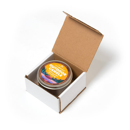 City Bonfires outdoor citronella candle with s'mores scent, featuring a glass jar and wooden lid for outdoor mosquito repellent.
