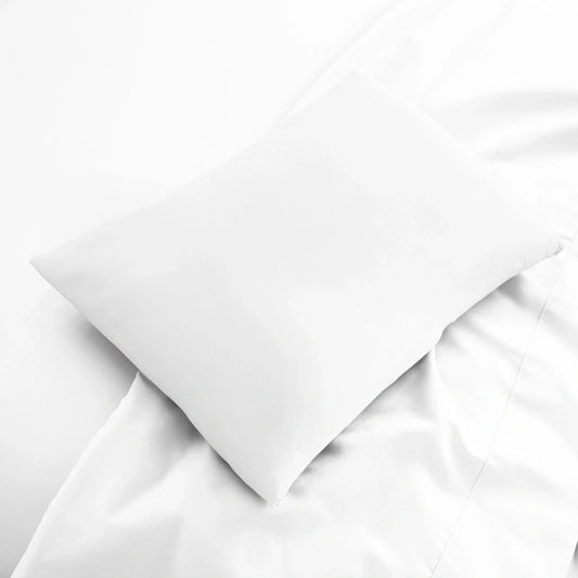 White cooling bamboo lumbar pillowcase from Bamboo is Better, made of soft, breathable bamboo fabric for comfortable travel and sleep.
