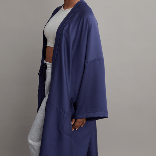 Kyrgies Zero-Waste Kimono robe in soft, sustainable fabric with wide sleeves and a relaxed fit, displayed on a neutral background.